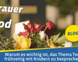 Blumenkranz vor einem Kreuz. Der Text "Trauer & Tod" und "BLOG" sind zu sehen. Es geht darum, was bedeutet tot und wie man es Kindern erklärt.