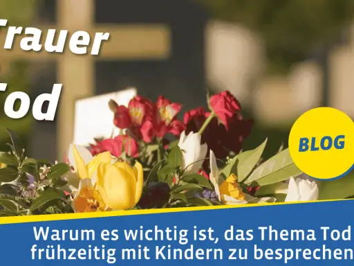Blumenkranz vor einem Kreuz. Der Text "Trauer & Tod" und "BLOG" sind zu sehen. Es geht darum, was bedeutet tot und wie man es Kindern erklärt.